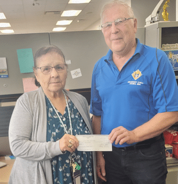 Dellia Pelletier (Chili for Children) receives cheque from GK Eugene