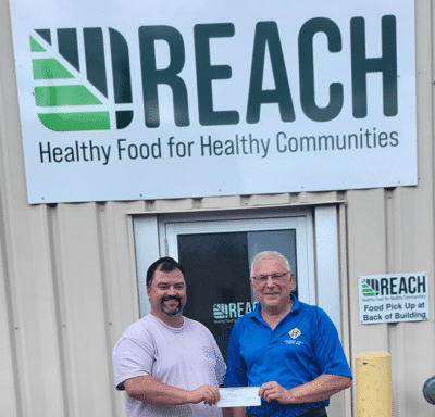 Matt Leisle (Ex Dir) receives cheque from GK Eugene