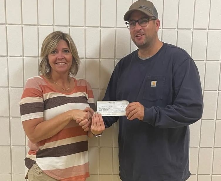 Feeding the Hungry in the Kelvington Area 1 Bro Steven Gutek, Council Culture of Life Director, presents the check to the Principal of the Archerwill School