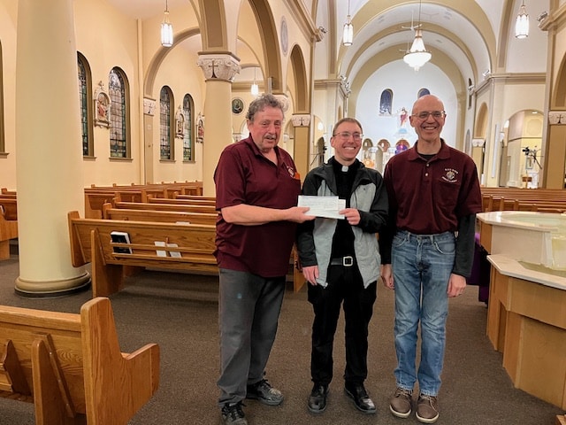 Council 1519 Prince Albert Presents Their Incentive Cheque 14 Father Travis Myrheim with GK Richard Beaulieu & FS Ray Langlois