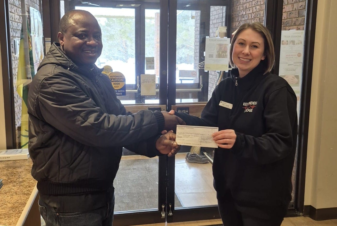 Father Kunka Council 6594 Presents Their Incentive Cheques 2 Kelvington Health Care Facility , cheque presented by Fr, Jerome, Chaplin of council to Melanie Turnbull