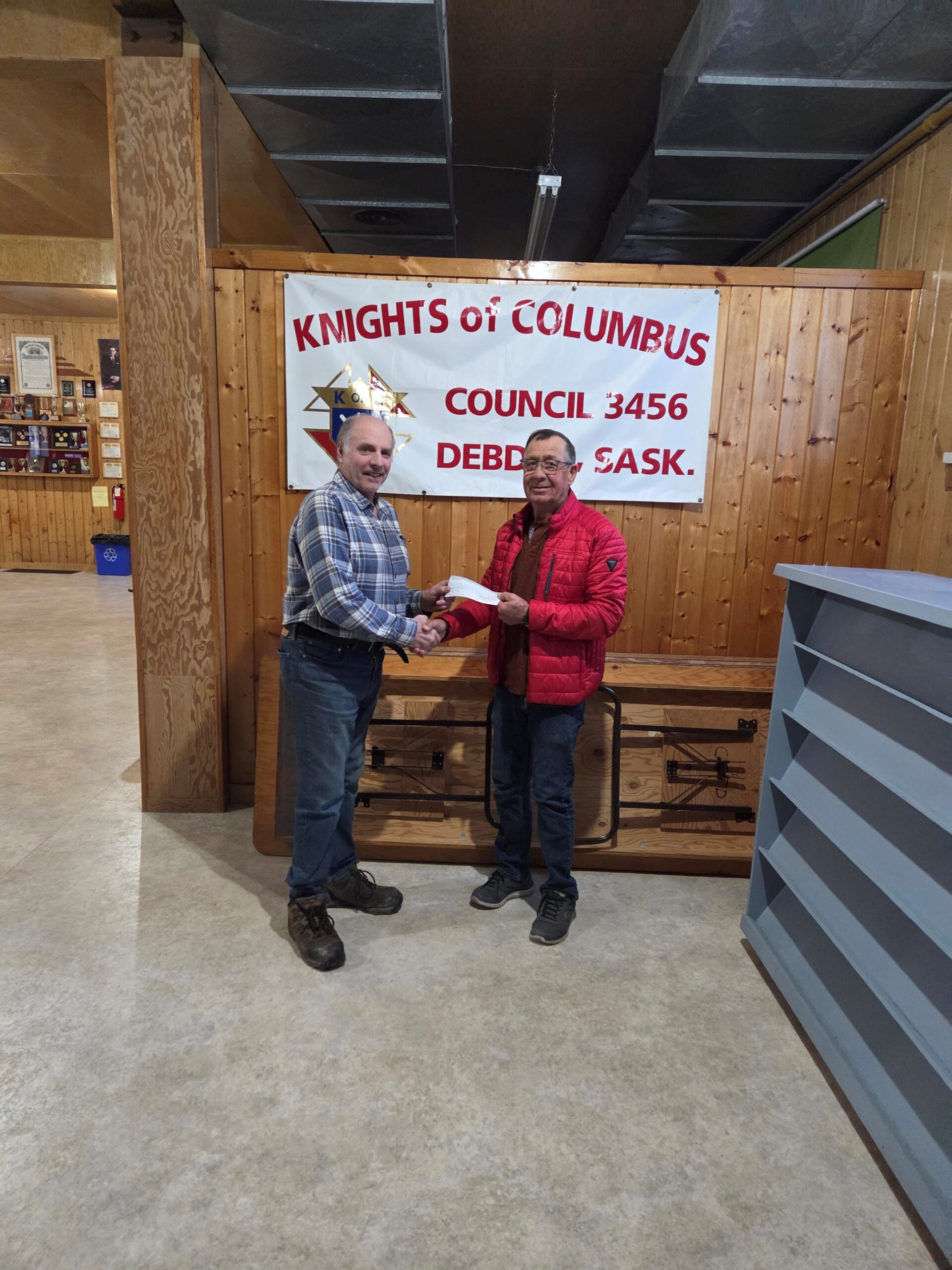 Debden Council #3456 Presents Their Incentive Cheques 3 FS Claude Ruel (left) with Alden Schwartz DGK on behalf of Victoire Parish)