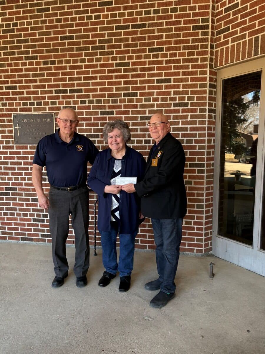 Weyburn Council #1731 Presents Their Incentive Cheques 3 Trustee PGK Brother Ron Klein, Care-A-Van Board Chairperson, Marga Cugnet, and GK Brother Richard Wick