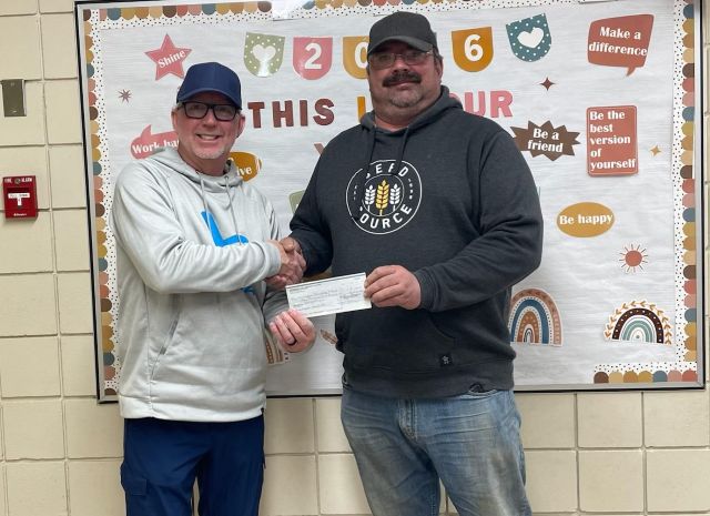 Bro Mitchell Staszczak, Chancellor, presented to Principal at Wadena Elementary School
