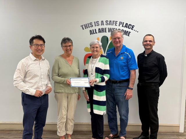 Adrienne & Mervyn Welter Education Endowment Fund makes a presentation 6 Mervyn and Adrienne Welter, representing the Saskatchewan Knights of Columbus Charitable Foundation and the Adrienne & Mervyn Welter Education Endowment Fund, along with Father Greg, Chaplain on the Charitable Foundation Board, presenting a $3,500 grant to CFS Battlefords. The grant was graciously accepted by Connie Carignan, Chairperson of the CFS Battlefords Board of Directors, and Chad Ku, Acting Executive Director.